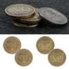 Un juego de monedas metálicas conmemorativas de oro mostrando diseños de 'SÍ' y 'NO'.
