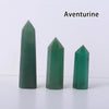 Three green aventurine crystal point prisms displayed on a white surface.