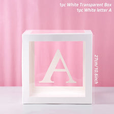 A clear white box with a large letter A inside, used for birthday and baby shower decorations.