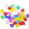 A collection of colorful acrylic crystal decorations in various shades including yellow, green, red, purple, and blue.