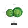 A set of realistic green fruit and vegetable fridge magnets, shaped like leafy produce.