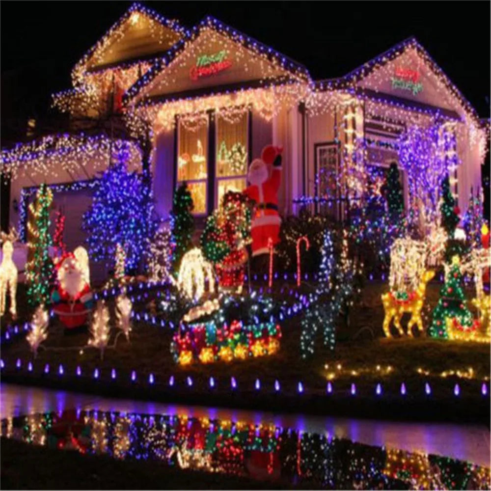 A house decorated with numerous outdoor LED string lights for holiday display.