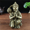 Bronze Hanuman statue figurine of a monkey god sitting in a meditative pose