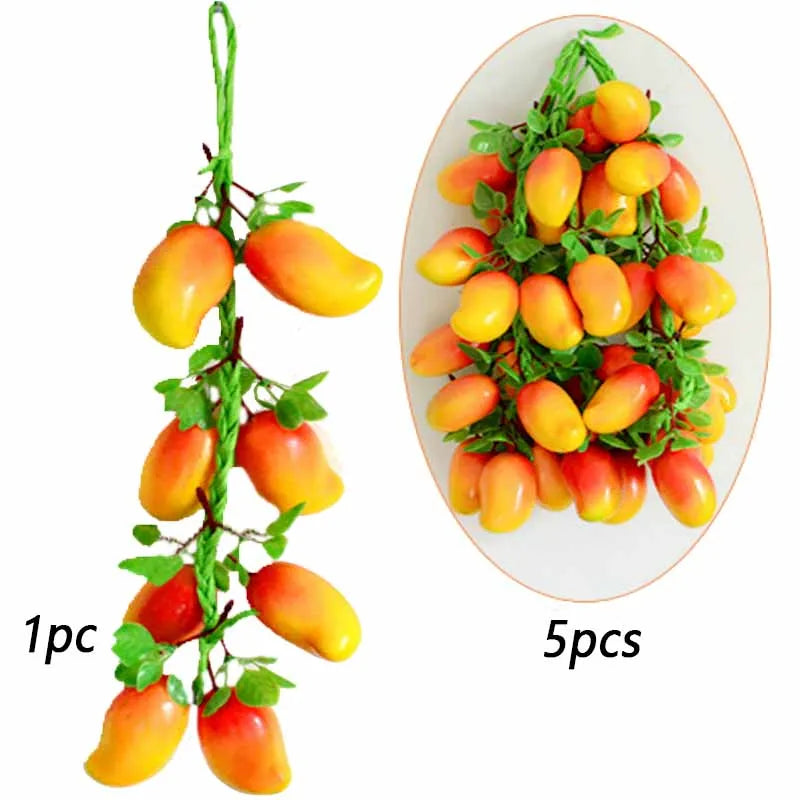 Five artificial yellow and orange fruit clusters on a green stem for decoration