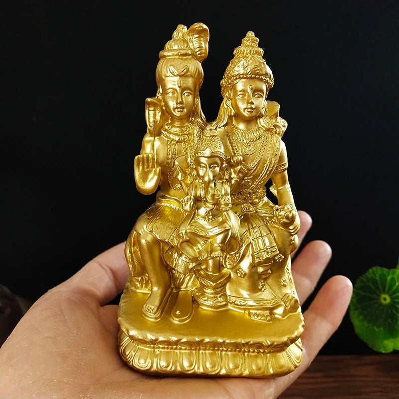 Hand-finished resin figurine of a Hindu or Buddhist deity with a child seated on its lap