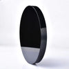 A smooth, oval black obsidian mirror with a reflective surface.