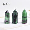 Three green and purple Epidote crystals displayed upright on a white surface.