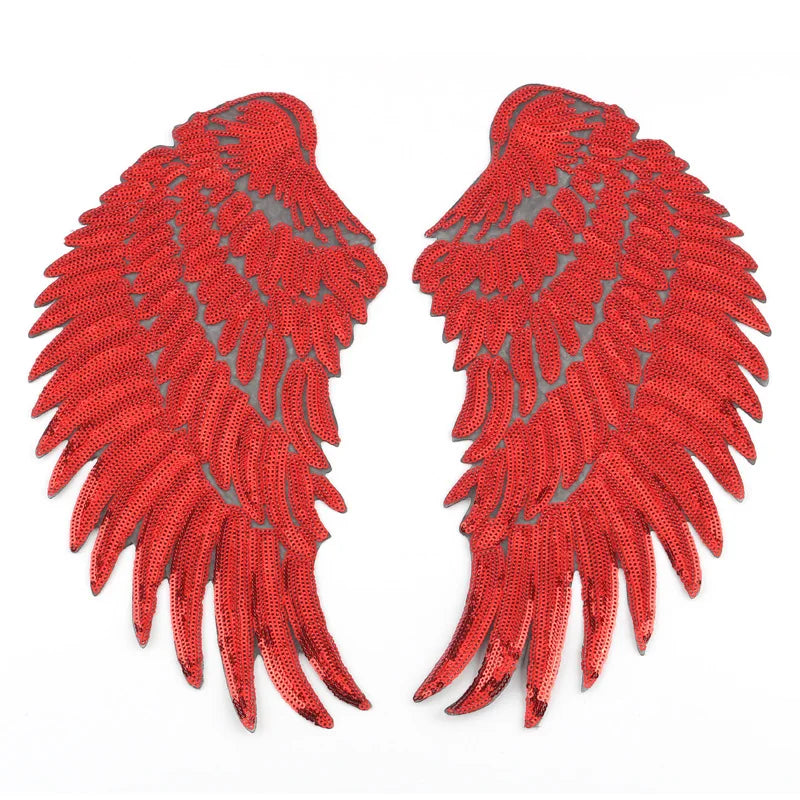 A pair of large, textured red sequin wing patches for DIY sewing or iron-on embellishment.