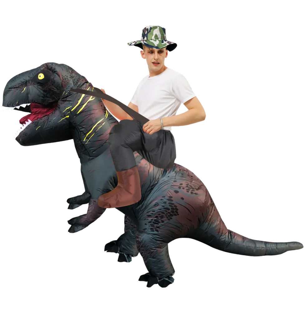 A man wearing a T-Rex inflatable costume and a camouflage hat poses with a prop claw.