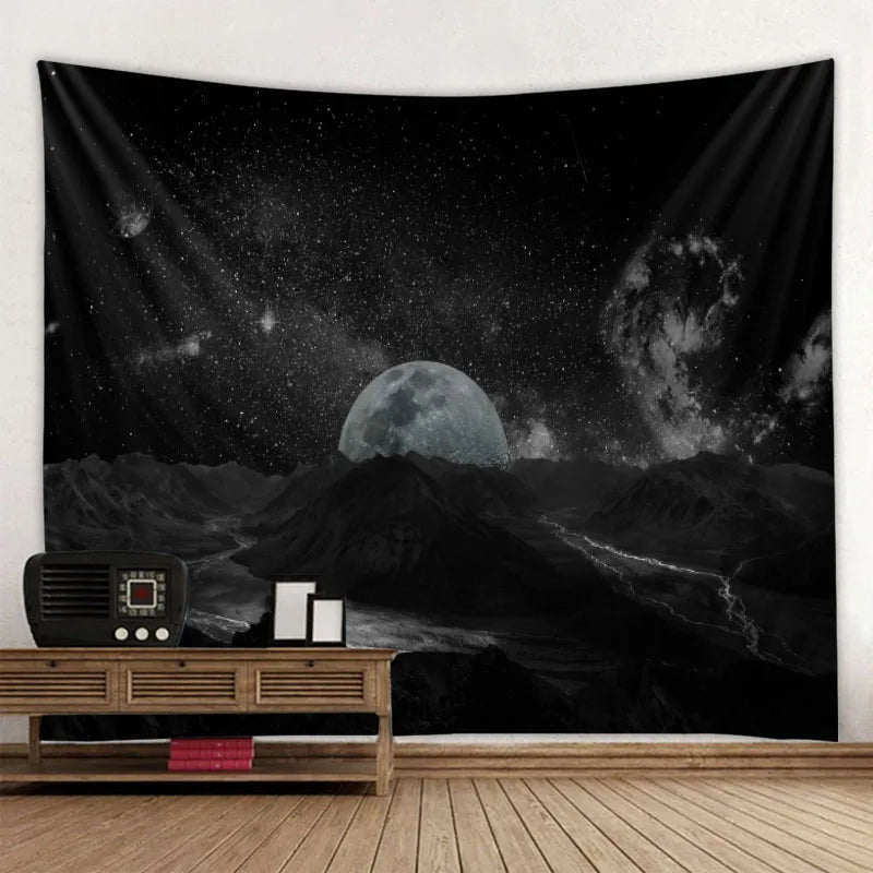 A dark tapestry depicting a moon and stars over a landscape with an old radio on a wooden shelf.