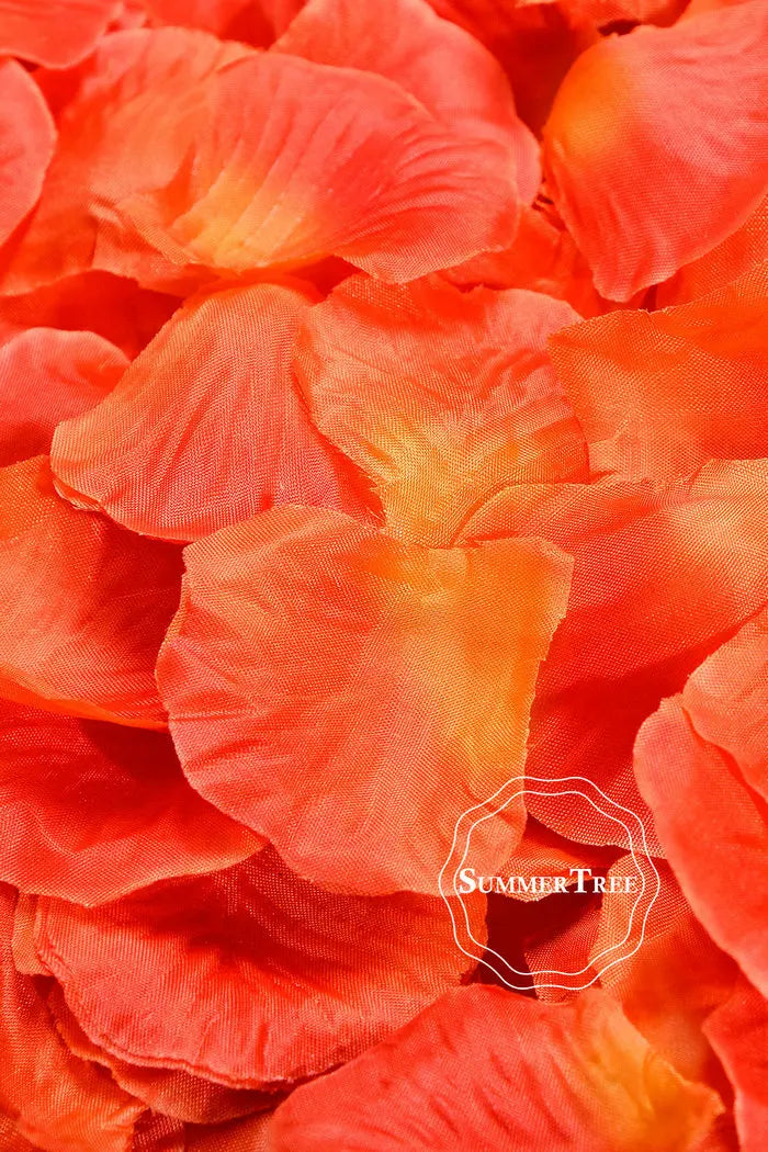 Vibrant orange silk rose petals arranged in a dense cluster for weddings and events.