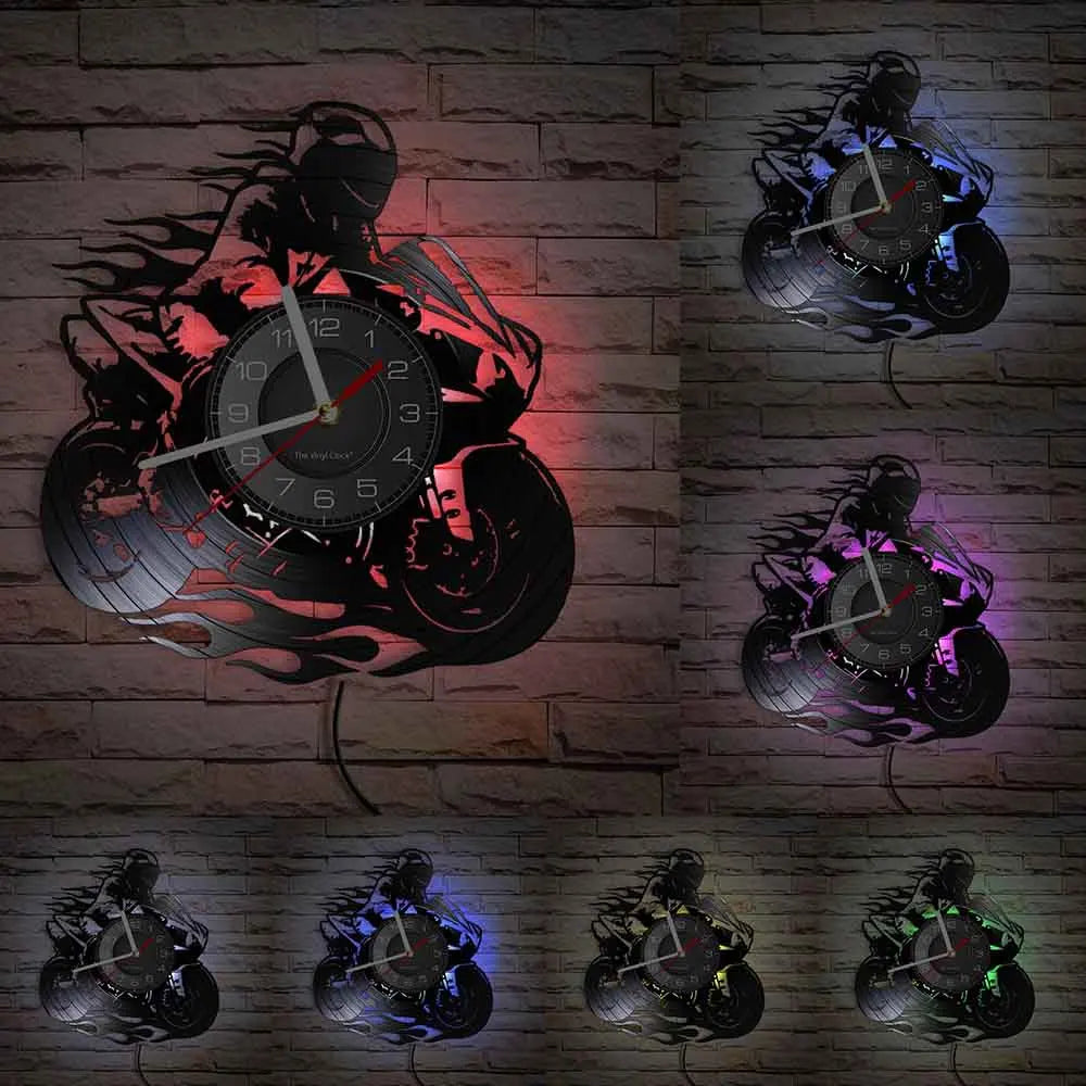 A set of five motorcycle rider vinyl record wall clocks displayed against a brick background.