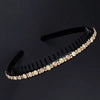 Black crystal rhinestone headband for women shown against a dark background