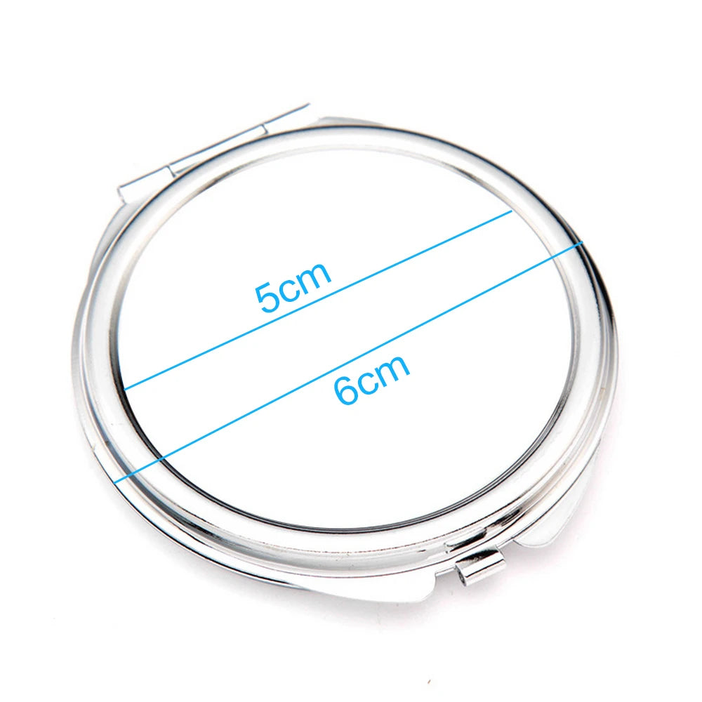 A clear, circular mini double-sided folding makeup mirror with measurements marked 5cm and 6cm.