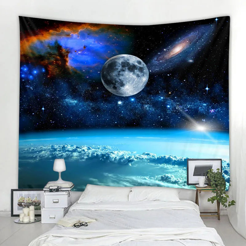 A tapestry depicting a vibrant night sky with a full moon and a spiral galaxy above a landscape view.