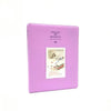 A purple compact photo album with a lid, designed for instant film.