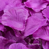 A close-up of vibrant purple silk rose petals used for weddings and events.