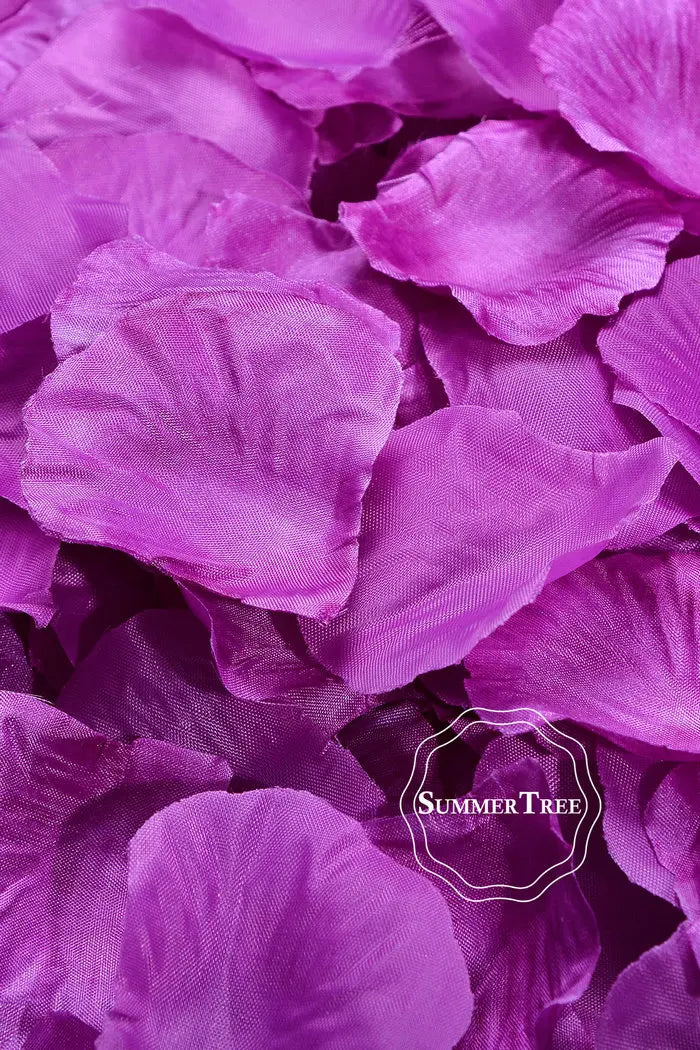 A close-up of vibrant purple silk rose petals used for weddings and events.
