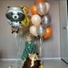 A set of foil balloons depicting woodland animals like a panda and a hedgehog, used for a party decoration.