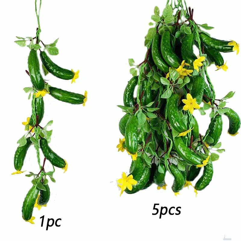 A bunch of five artificial green chili peppers with small yellow flowers.