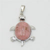 Silver pendant necklace featuring a polished pink rose quartz oval stone shaped like an animal.