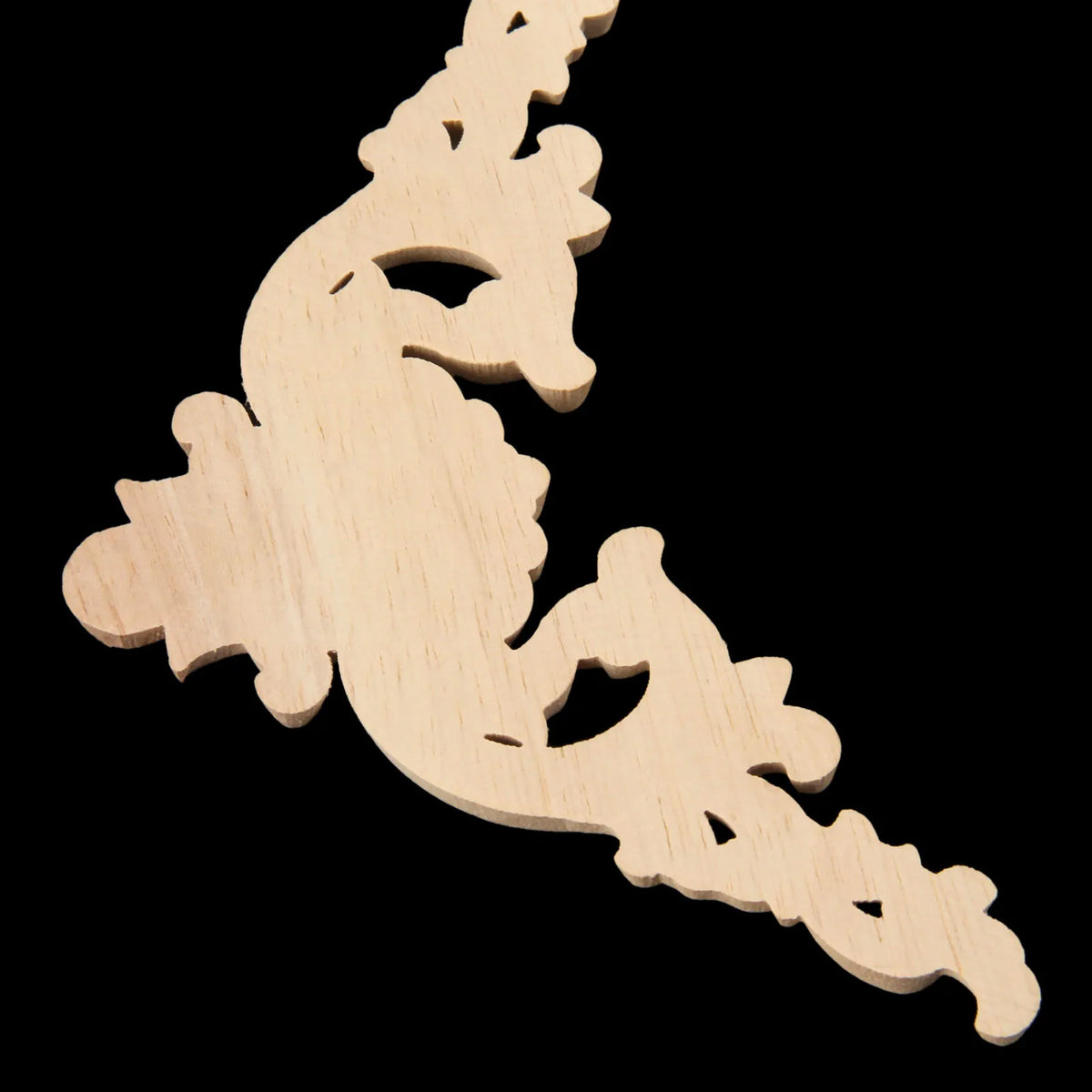 Two oak wood corner carvings featuring a European branch and crown design.