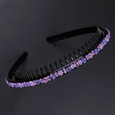 Black hairbrush with purple crystal rhinestones used as a headband