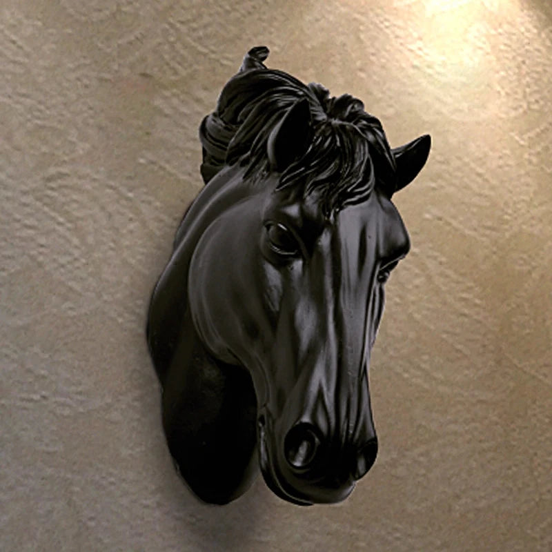 A black 3D resin horse head sculpture mounted on a wall.