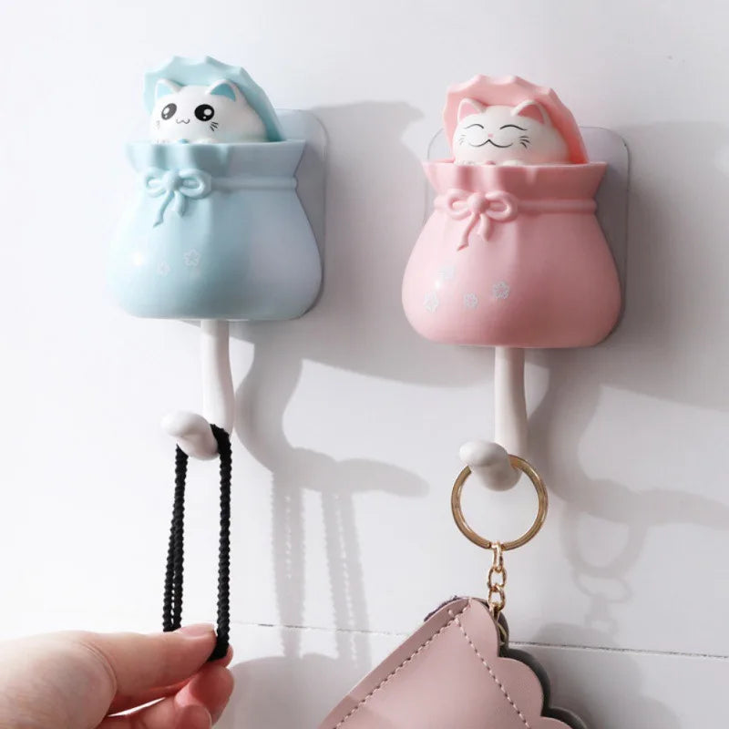 Pink and blue cartoon cat wall hooks with hanging loops for organization
