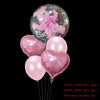 A collection of pink latex balloons including a bear balloon, heart balloons, and a bear balloon.