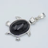 Silver pendant necklace featuring a polished black oval natural stone shaped like an animal.
