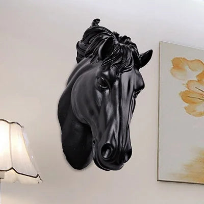 A black 3D resin horse head wall sculpture mounted on a white wall.