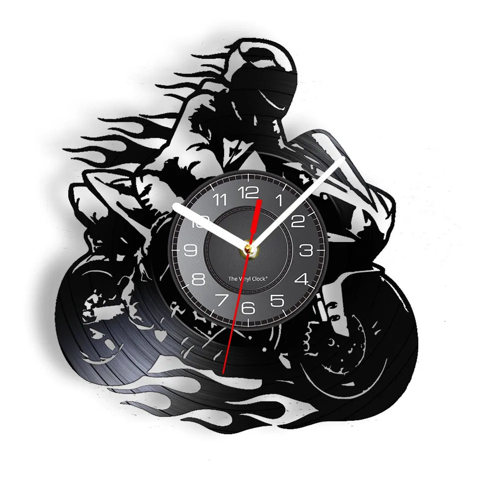 A black and white graphic of a motorcycle rider silhouette surrounding a round vinyl record wall clock.