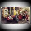 A vintage red Formula 1 race car with a driver standing beside it in front of old yellow and silver vintage gas pumps.