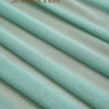 Light mint green chiffon fabric draped and folded to show texture