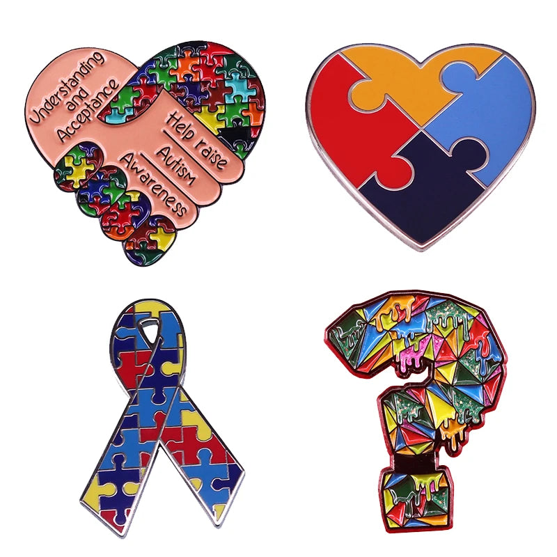A set of puzzle ribbon pins featuring rainbow colors and awareness messages for autism.