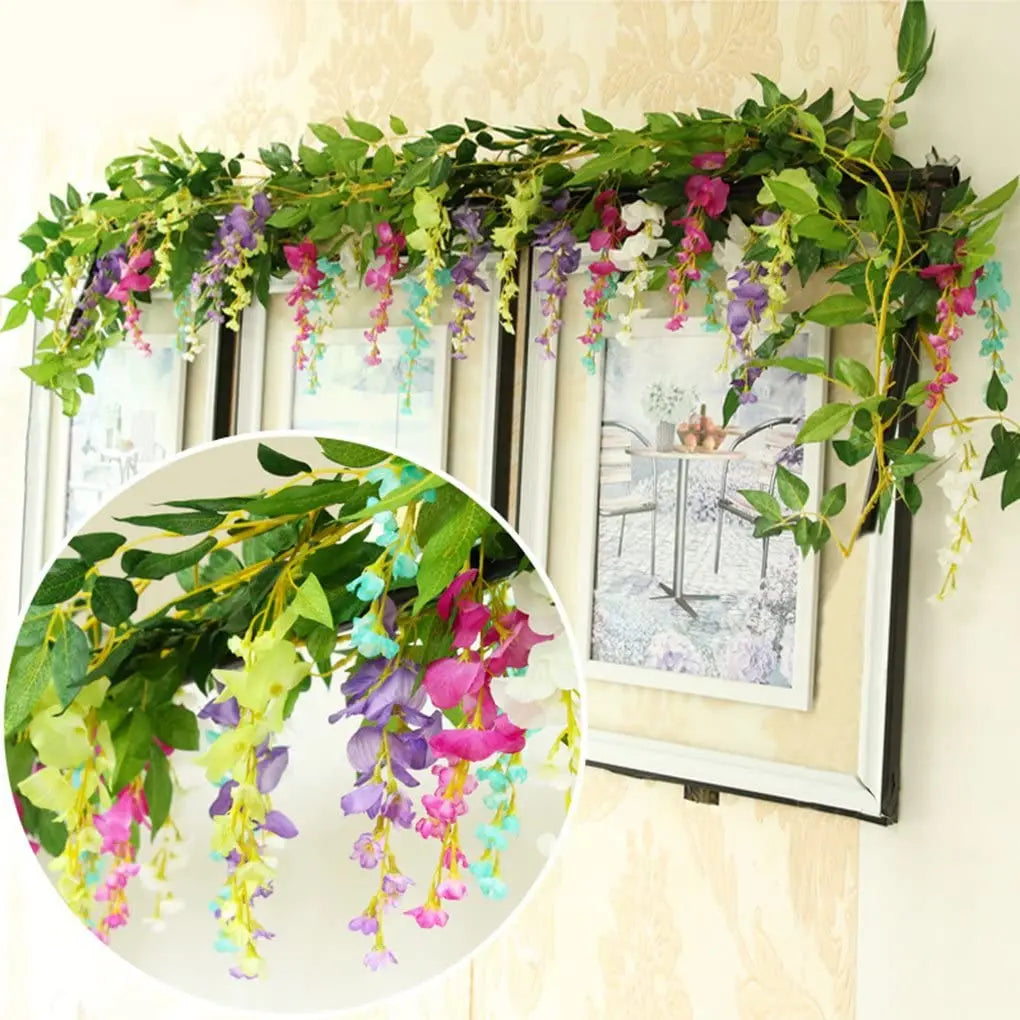 Green and purple silk wisteria garland vine draped across a window frame for home decor