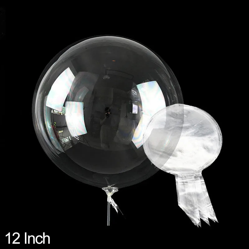 A clear PVC party balloon is shown against a black background.