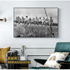 Black and white canvas wall art depicting a cityscape skyline with people on a train.
