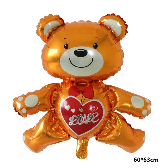 Globo de aluminio naranja con forma de oso de peluche y un corazón rojo en el pecho.