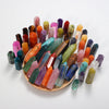A collection of colorful natural crystal points and prisms arranged in a tower for meditation or home decor.