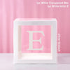 A white transparent box with the letter E inside, used for first birthday and baby shower decorations.