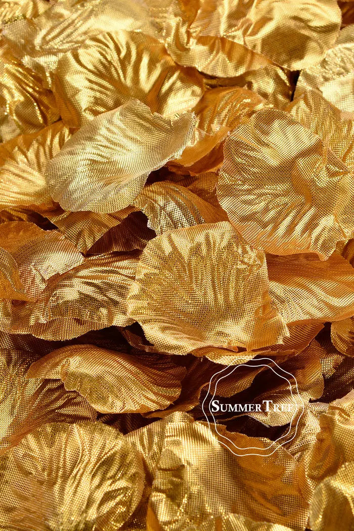 A close-up of golden silk rose petals used for weddings and events.