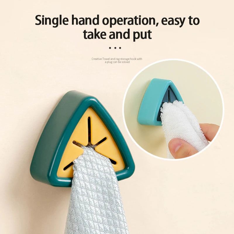 A single hand operation towel and rag storage hook with a plug for easy take and put.