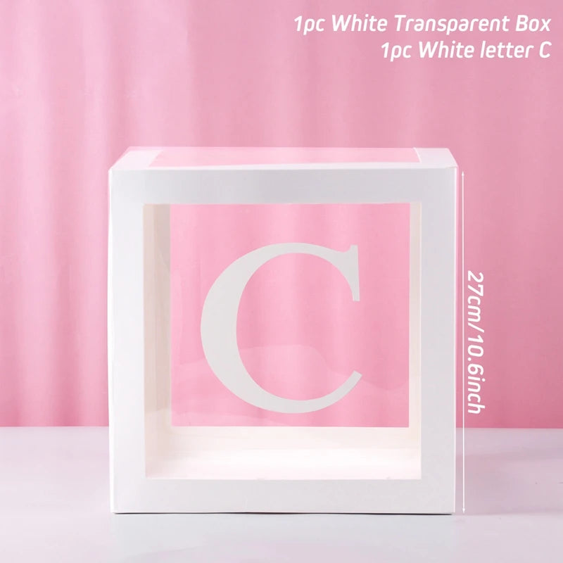 A white transparent box with the letter C inside, used for birthday and baby shower decorations.