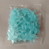 A clear plastic bag filled with a 50-pack of light blue glow-in-the-dark star wall stickers.