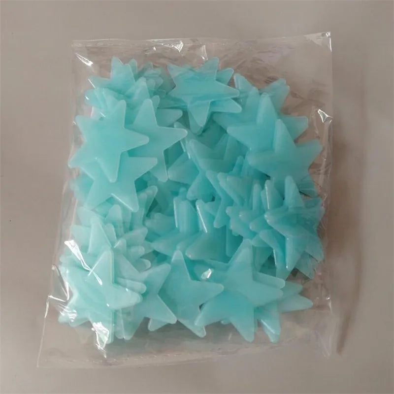 A clear plastic bag filled with a 50-pack of light blue glow-in-the-dark star wall stickers.
