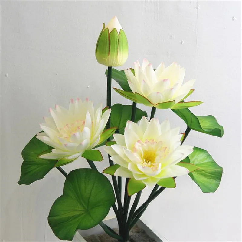 Artificial lotus flower bunch with green frog accent featuring white and green blooms.