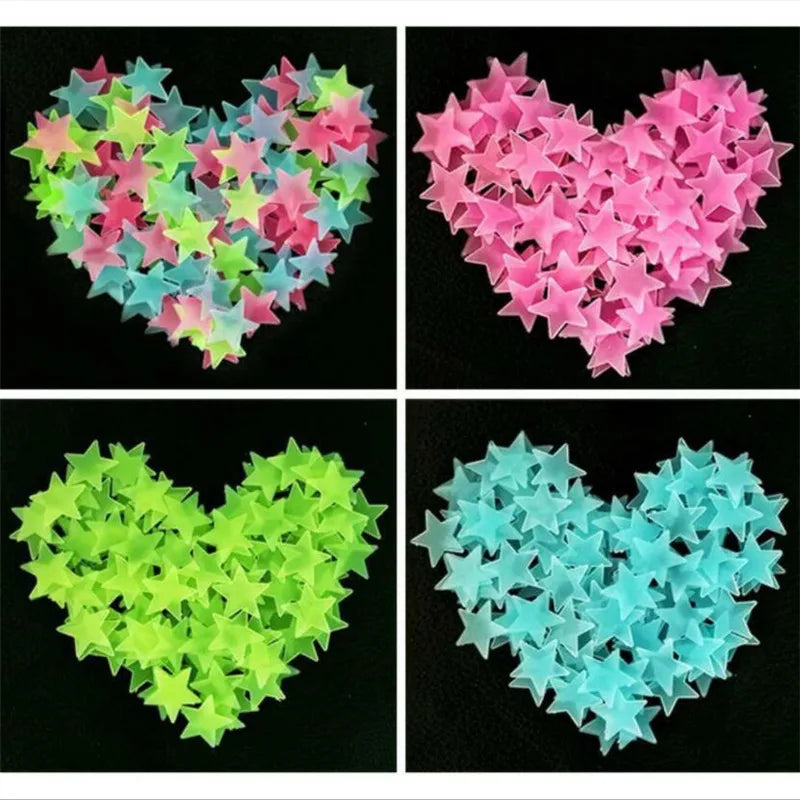 A collection of glow-in-the-dark star wall stickers in various shades of pink, green, and blue arranged in heart shapes.