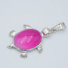Silver pendant necklace featuring a polished pink oval natural stone shaped like an animal.